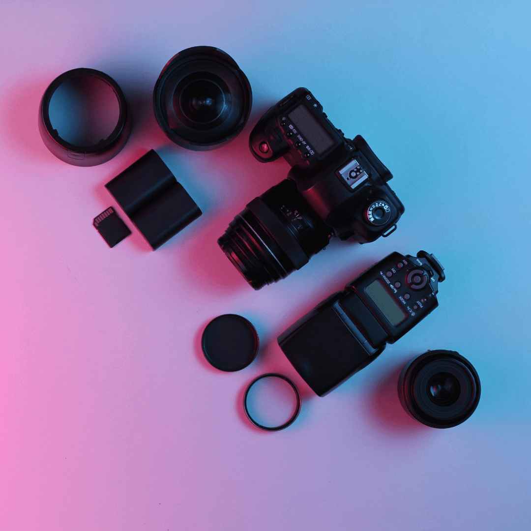camera gear flat lay on desk